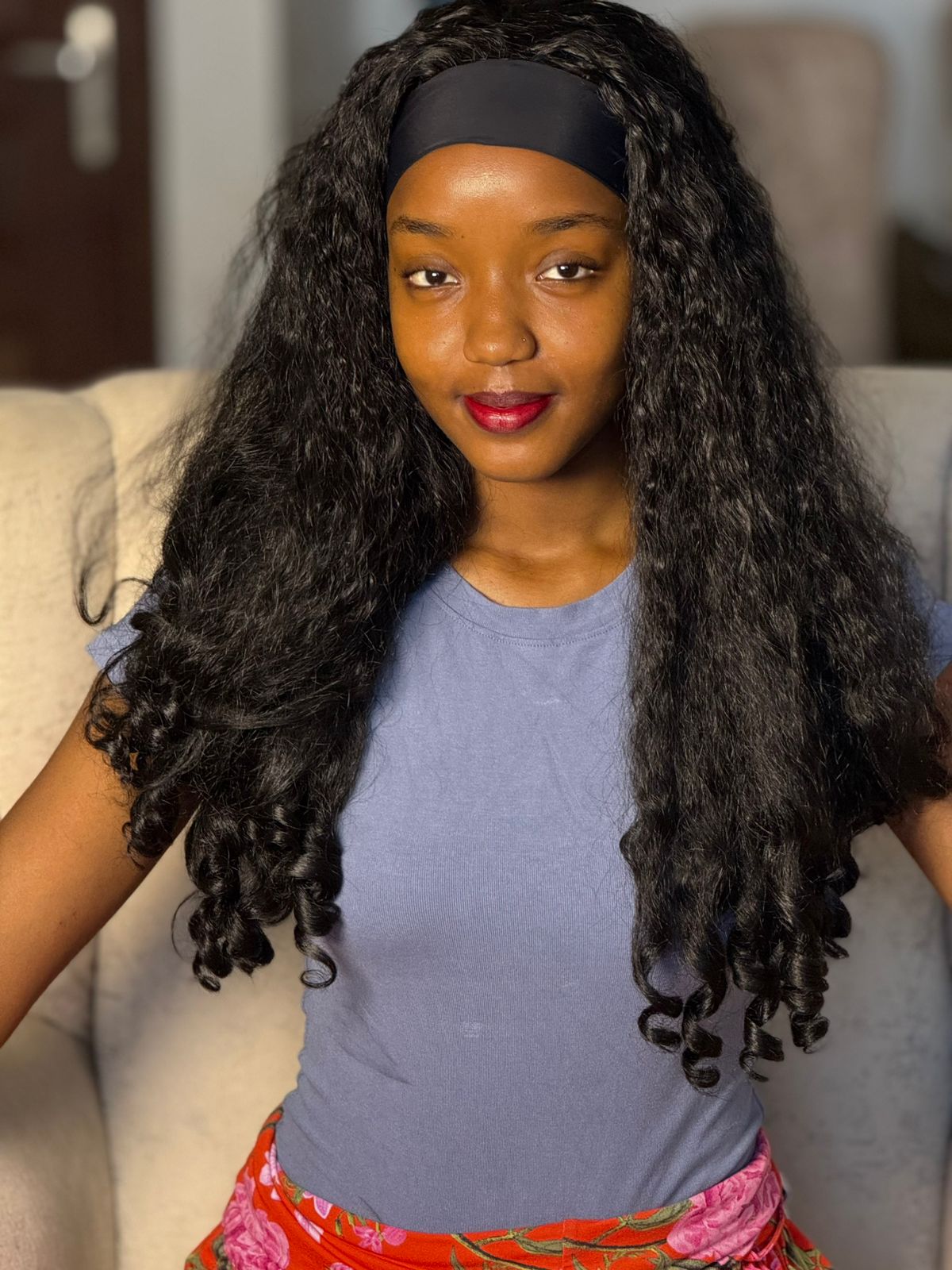 Model showcasing curly wig style